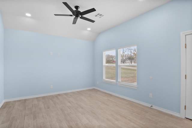 empty room with ceiling fan, light wood-type flooring, and lofted ceiling