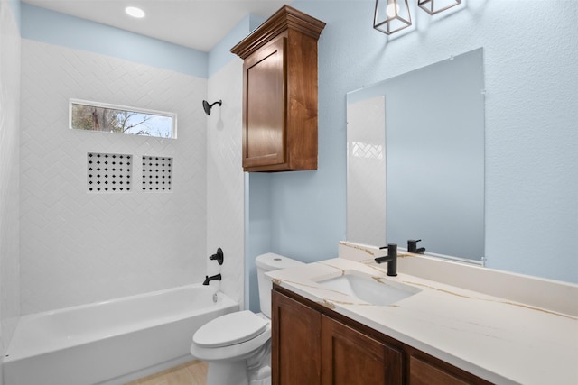 full bathroom with bathing tub / shower combination, vanity, and toilet