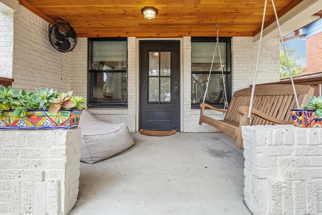 entrance to property featuring a porch