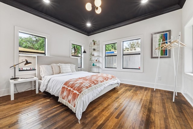 bedroom featuring dark hardwood / wood-style floors and ornamental molding