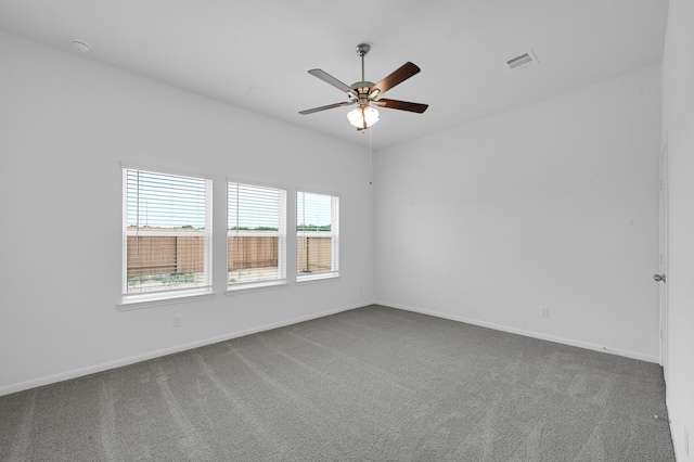 empty room featuring ceiling fan and carpet floors