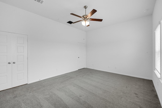 carpeted empty room with ceiling fan