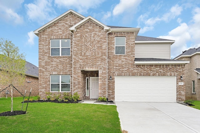 view of front of property with a front yard and a garage