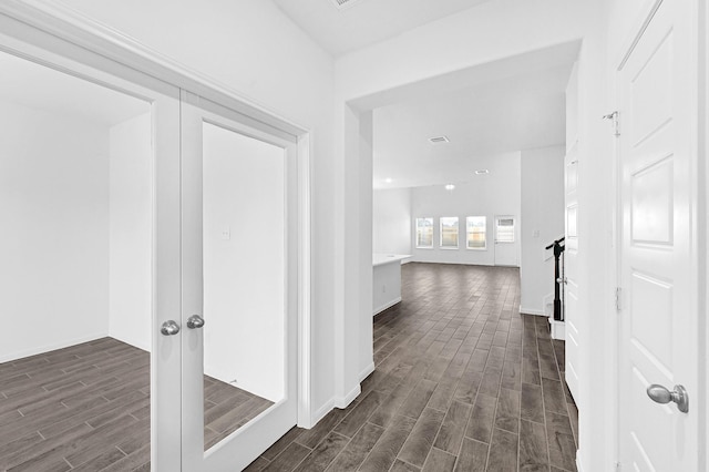 corridor featuring french doors