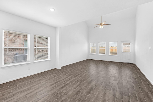 unfurnished living room featuring dark hardwood / wood-style flooring and ceiling fan