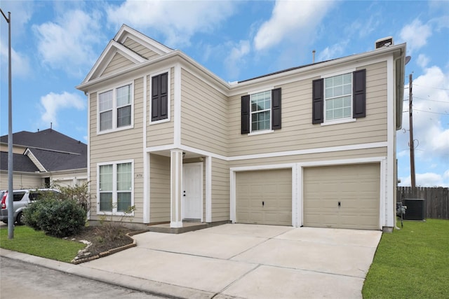 view of property with central AC unit, a garage, and a front yard