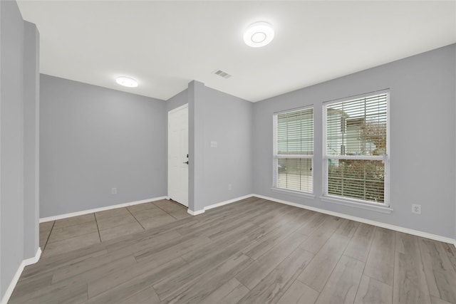 empty room with light wood-type flooring