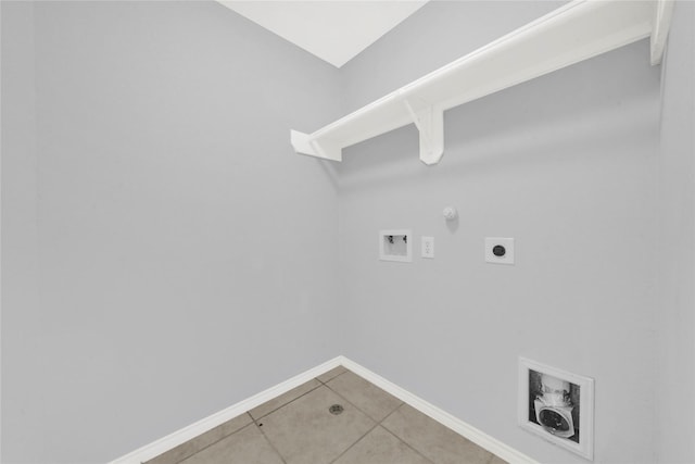 laundry room with hookup for an electric dryer, hookup for a washing machine, tile patterned floors, and gas dryer hookup