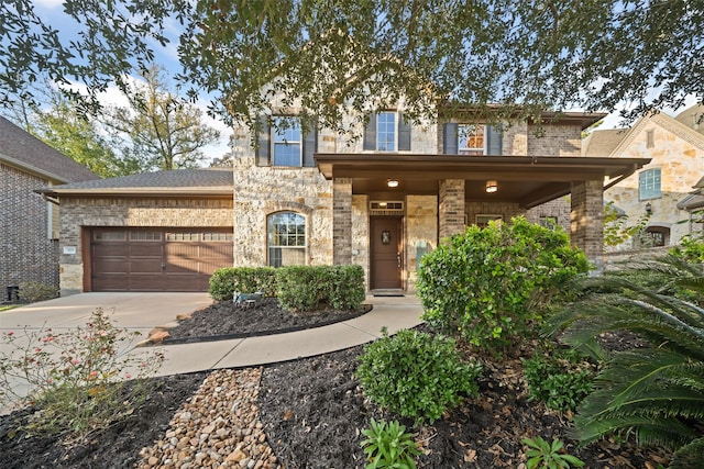 view of front of house featuring covered porch and a garage