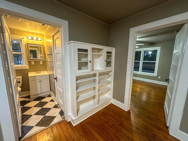 corridor featuring dark wood-type flooring