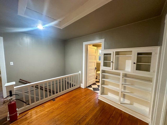 hall with hardwood / wood-style flooring