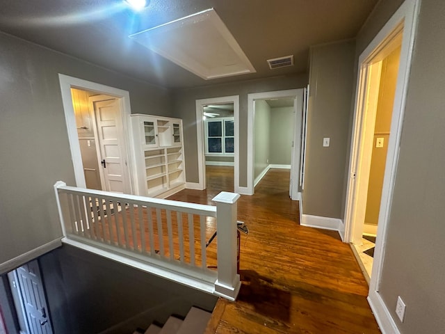 corridor featuring wood-type flooring