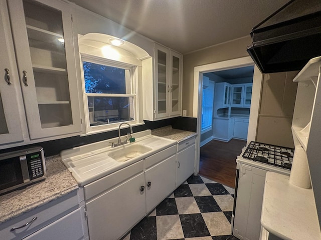 kitchen with white cabinets and sink