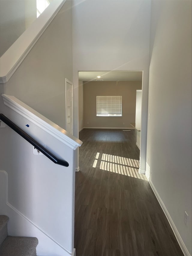 corridor featuring dark wood-type flooring