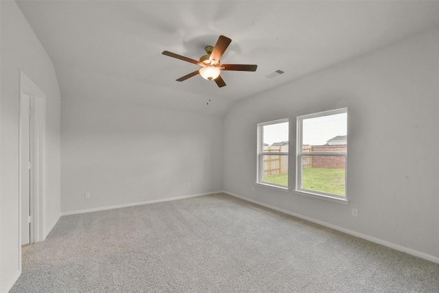 spare room with light carpet, ceiling fan, and lofted ceiling