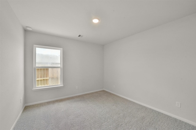 unfurnished room featuring carpet