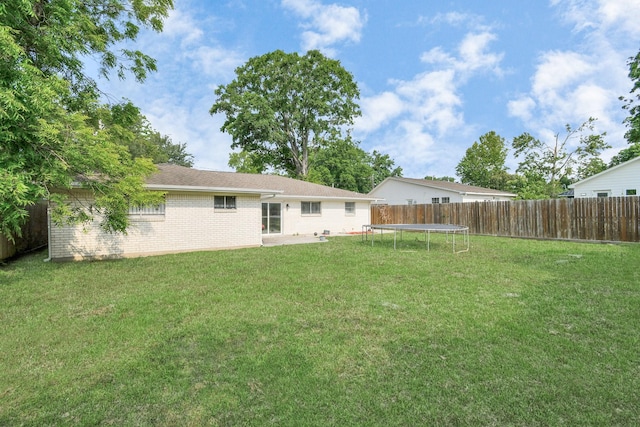 view of yard with a trampoline