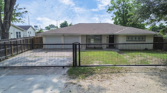 view of front of house with a front yard and a garage