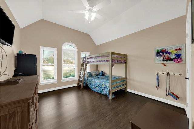 bedroom with ceiling fan, dark hardwood / wood-style floors, and vaulted ceiling