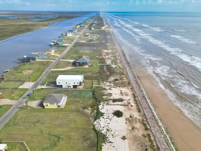 bird's eye view with a view of the beach and a water view