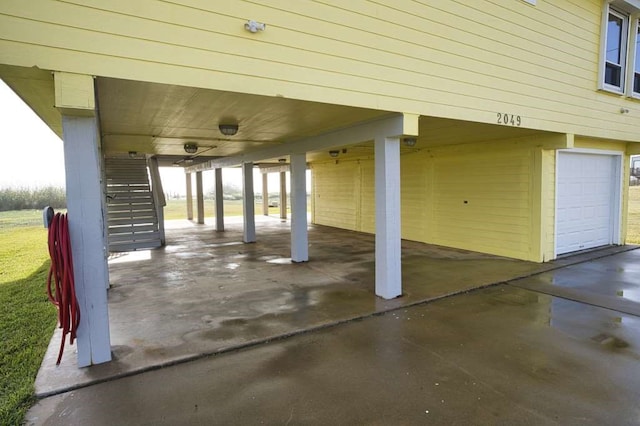 view of patio / terrace featuring a garage