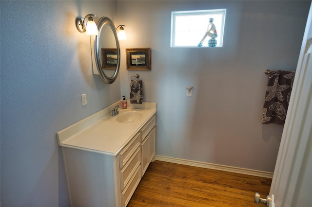 bathroom featuring hardwood / wood-style floors and vanity