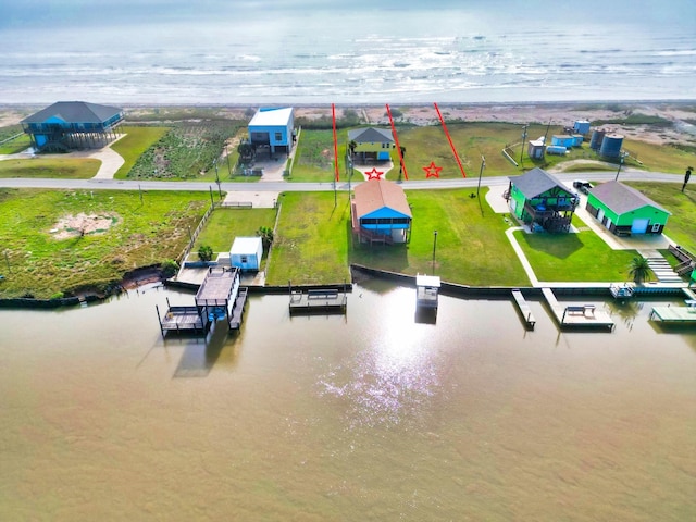 bird's eye view with a water view