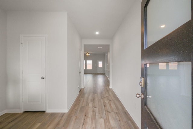 hall with light hardwood / wood-style flooring