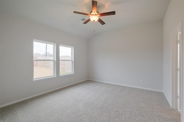 carpeted spare room with ceiling fan