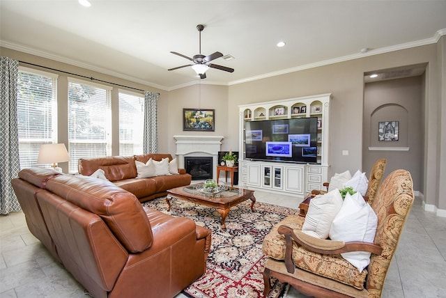 tiled living room featuring ceiling fan and crown molding