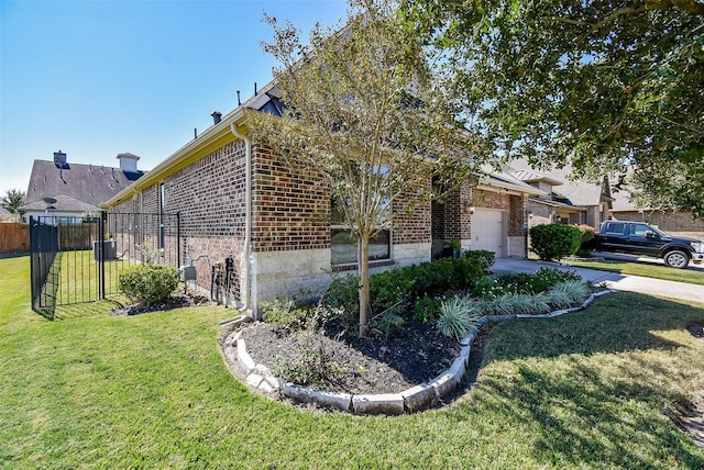 view of home's exterior featuring a lawn and a garage