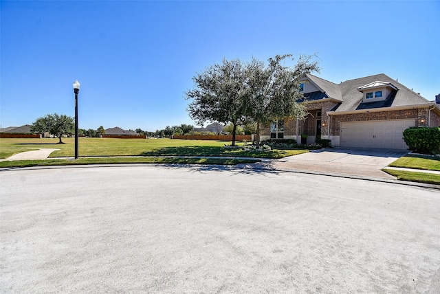 view of front of house featuring a garage and a front yard