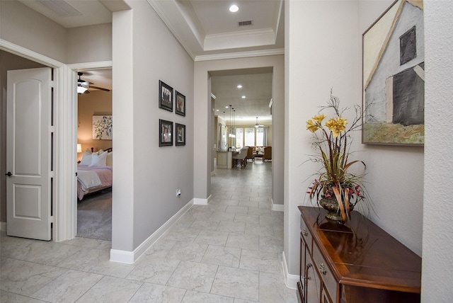 hall featuring ornamental molding