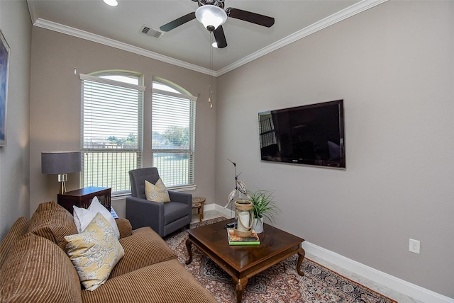 living room featuring plenty of natural light, ornamental molding, and ceiling fan