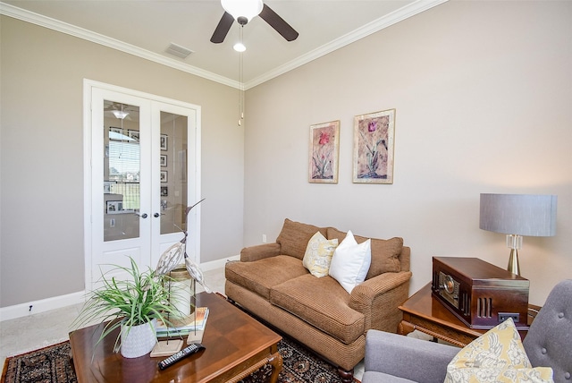 living room featuring ceiling fan, ornamental molding, and french doors