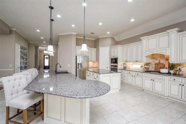 kitchen with tasteful backsplash, dark stone counters, stainless steel appliances, a spacious island, and hanging light fixtures