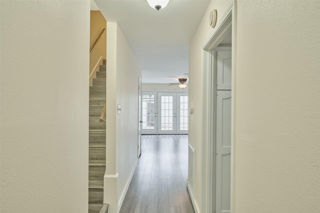 hallway featuring french doors and hardwood / wood-style flooring