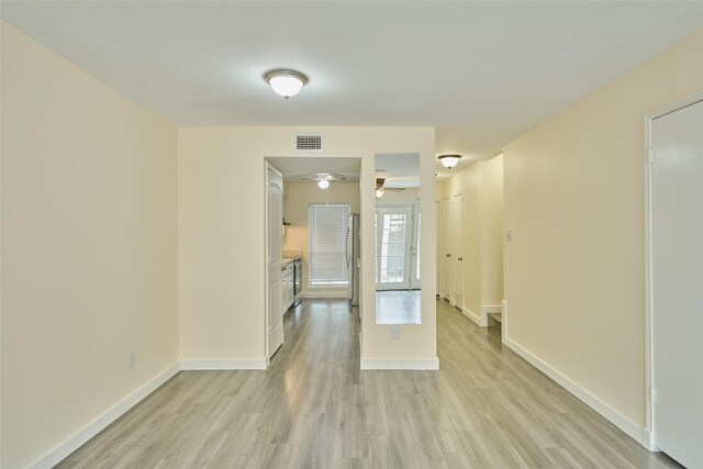 unfurnished room with ceiling fan and light hardwood / wood-style flooring