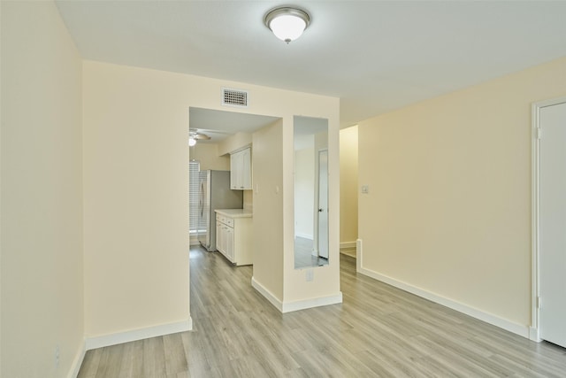 empty room with light wood-type flooring