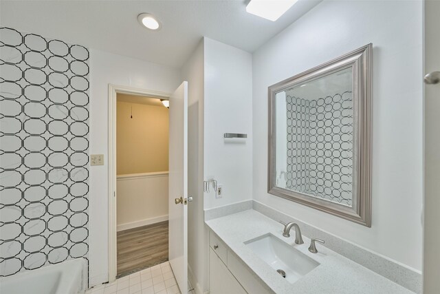 bathroom with vanity and tile patterned flooring