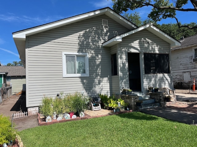 view of front of home with a front yard