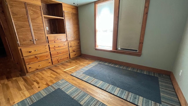 unfurnished bedroom with light hardwood / wood-style flooring