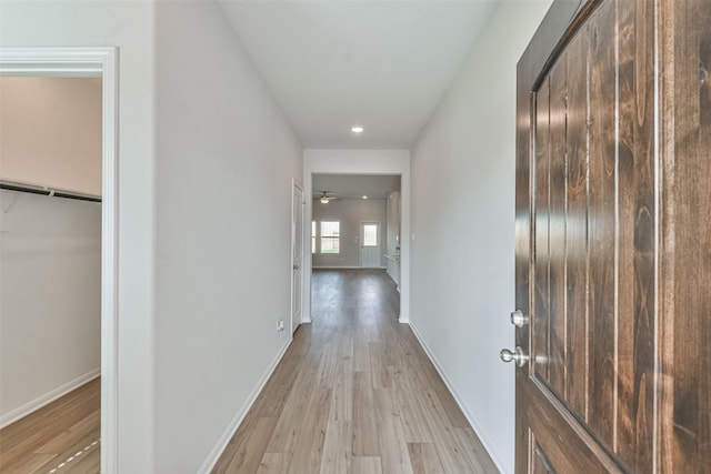 hall with light hardwood / wood-style flooring