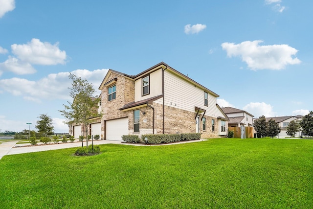 view of side of property with a yard and a garage