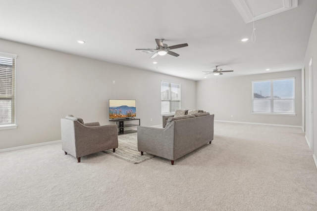 living room with ceiling fan and light colored carpet