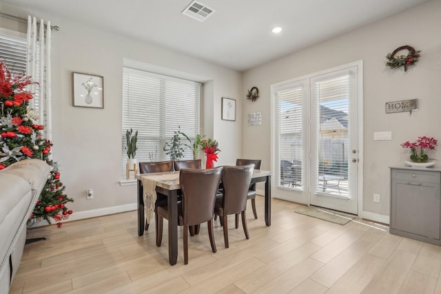 dining space featuring light hardwood / wood-style floors