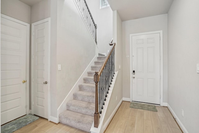 foyer entrance with light hardwood / wood-style floors