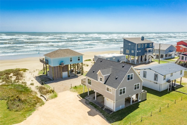 aerial view with a view of the beach and a water view