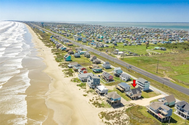 aerial view with a view of the beach and a water view