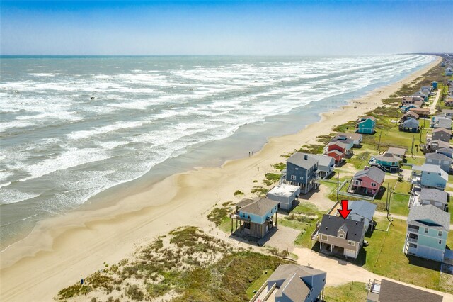 drone / aerial view with a view of the beach and a water view